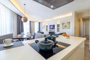 a kitchen and living room with a stove top oven at A Scenic Escape within Nairobi in Nairobi