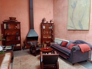 a living room with a couch and a fireplace at Casa Rural Mas En Calma in Cabanes