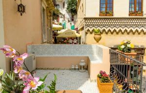 a view of a courtyard in a building with flowers at SUITE MARINELLA -TAORMINA in Taormina
