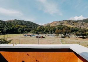 a view of a baseball field and a mountain at Kastel Itaipava in Itaipava