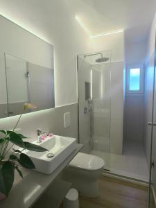 a bathroom with a sink and a toilet and a shower at VILLA SAVINA in Cala en Blanes +33 photos