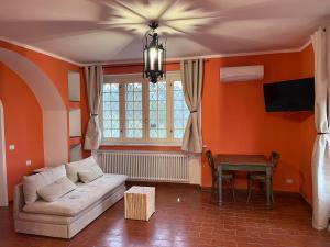 a living room with a couch and a table at Alla Fortezza in Sarzana