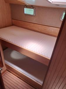an empty bed in the back of a van at Bleu soleil in Dieupentale