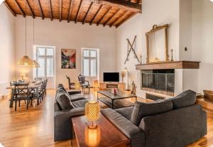 a living room with a couch and a table at Villa Marisa in Ax-les-Thermes