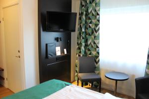 Postel nebo postele na pokoji v ubytování Sturup Airport Hotel