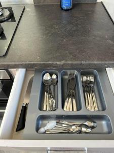 a tray filled with utensils on a kitchen counter at haven kent coast in Allhallows