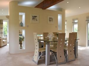 a dining room with a table and chairs at The Lodge - Uk11271 in Lanreath