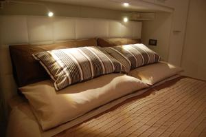 Un ou plusieurs lits dans un hébergement de l'établissement Loft Due Cuori con terrazza