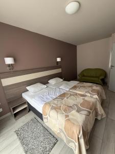 a bedroom with two beds in a room at Apartament Rajka in Biała Woda