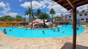a group of people in the swimming pool at a resort at CLUBE e HOTEL ARIRANG in Itu