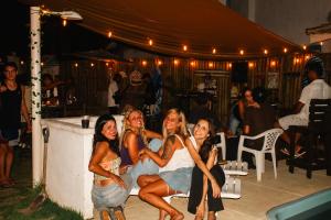 a group of women posing for a picture at a party at Piratas Guest Rooms II in Búzios +32 photos
