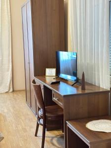 a desk with a computer on top of it at Apartments Vojin in Risan