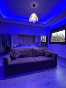 a bedroom with a large bed with a blue ceiling at black tiger villa in ‘Ezbet `Abd el-Ḥamîd +33 photos