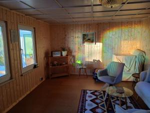 a living room with a couch and a chair at Haus Elise in Saalfeld