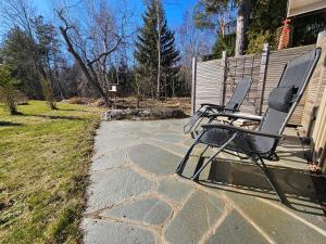 a pair of chairs sitting on a patio at Fahléns 10 Villa in Jomala