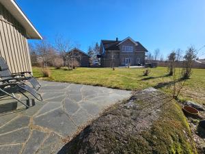 a stone walkway in front of a house at Fahléns 10 Villa in Jomala