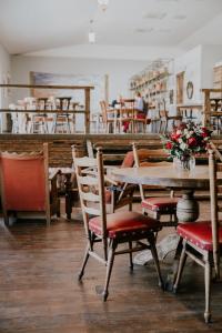 a dining room with a table and chairs at Green Sheep Boutique Hotel in Kazbegi +20 photos
