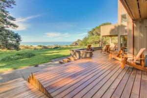 a wooden deck with benches on a house at Webb House in Valley Crossing