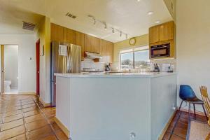 a kitchen with a large island in a room at Windrow Retreat in Sea Ranch