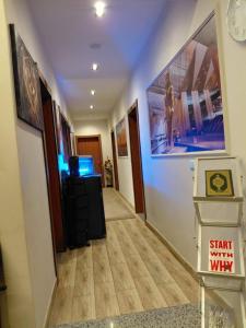 a hallway withstart with the why sign on the wall at Italia Hotel Cairo in Cairo