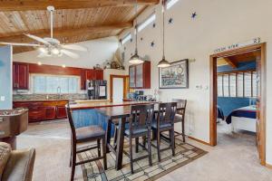 a kitchen and dining room with a table and chairs at Ocean Star in Sea Ranch