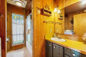 a bathroom with a sink and a mirror at Thayer House in Sea Ranch +14 photos