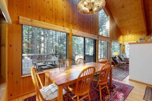 a dining room with a wooden table and chairs at Longwell House in Sea Ranch