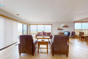 a living room with two chairs and a table at Double R in Gualala