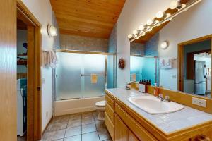 a bathroom with a sink and a shower and a toilet at Double R in Gualala
