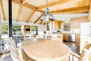 a kitchen and dining room with a wooden table at Casa Contenta in Gualala