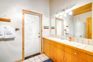 a bathroom with a sink and a mirror at Casa Contenta in Gualala