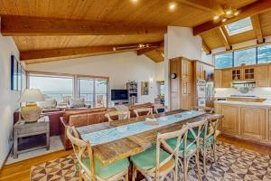 a kitchen and living room with a table and chairs at Brammer's Bluff in Sea Ranch