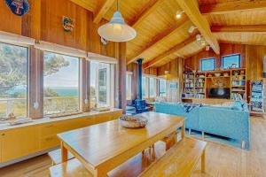 a living room with a table and a couch at Gewing House in Sea Ranch