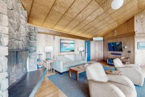 a living room with a couch and a fireplace at Curtis-Moulton Retreat in Sea Ranch