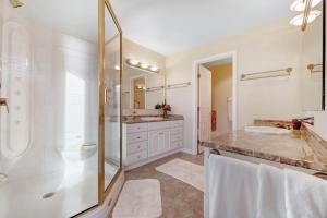 a bathroom with two sinks and a shower at The Cliff House in Gualala