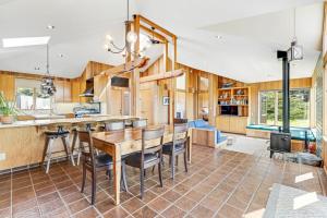 a kitchen and dining room with a table and chairs at Toto House in Gualala