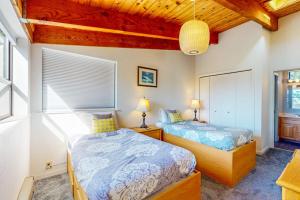 a bedroom with two beds and a window at The Bobcat House in Sea Ranch +20 photos