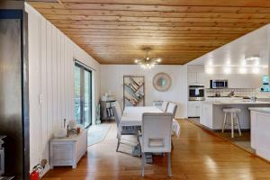 a kitchen and dining room with a table and chairs at Tree House in Sea Ranch