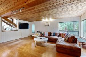 a living room with a couch and a table at Tree House in Sea Ranch +22 photos