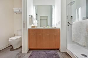 a bathroom with a sink and a toilet and a mirror at Sky Fall in Sea Ranch