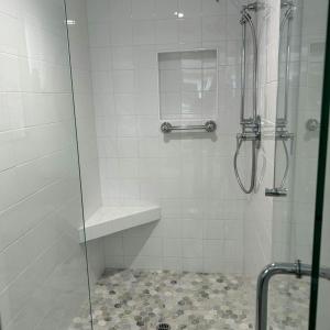 a bathroom with a shower with a glass door at Sea Trees in Sea Ranch +23 photos