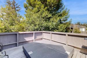 a mattress on a deck with a fence at Footloose in Sea Ranch