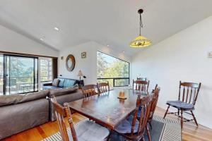 a living room with a table and a couch at Footloose in Sea Ranch