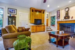 a living room with a couch and a fireplace at Spyglass View in Sea Ranch