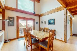a dining room with a wooden table and chairs at The Barn in Gualala