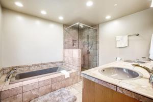 a bathroom with a tub and a sink at Ascona House in Sea Ranch