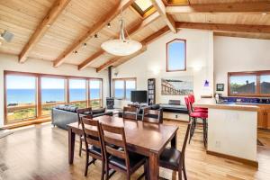 a kitchen and dining room with a table and chairs at Ascona House in Sea Ranch