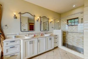 a bathroom with two sinks and a shower at Seascape Gualala in Gualala