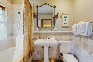 a bathroom with a sink and a toilet and a mirror at Seascape Gualala in Gualala +26 photos