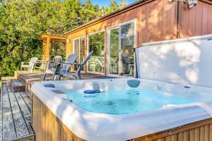 a hot tub on the deck of a house at Cove House in Gualala +13 photos